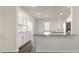 Bright kitchen features granite countertops, white cabinets, and stainless steel appliances at 132 Paper Birch Way, Fuquay Varina, NC 27526