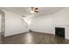 Large living room featuring hardwood-style floors, fireplace, and staircase at 132 Paper Birch Way, Fuquay Varina, NC 27526