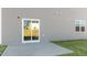 View of patio featuring sliding glass doors and lush green lawn at 132 Paper Birch Way, Fuquay Varina, NC 27526