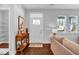 Inviting foyer flows into the living room, providing ample natural light and a cozy atmosphere at 135 Village Walk Dr, Clayton, NC 27527