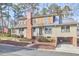 Charming two-story home with a combination of vertical siding and shake exterior and a metal roof at 1400 Oakland Ave, Durham, NC 27705