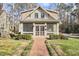 Charming two-story home with inviting front porch, brick walkway, and manicured landscaping at 1400 Oakland Ave, Durham, NC 27705