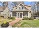 Charming home with inviting front porch, brick walkway, and manicured lawn at 1400 Oakland Ave, Durham, NC 27705