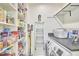 Organized laundry room with shelves, utility ladder and front load washer and dryer at 1400 Oakland Ave, Durham, NC 27705