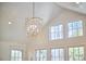 Vaulted ceilings illuminated by a modern, geometric chandelier and natural light from multiple windows at 1400 Oakland Ave, Durham, NC 27705