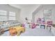 Cozy playroom with plush couch, table, and ample toy storage at 1400 Oakland Ave, Durham, NC 27705