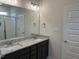 Bathroom featuring double sinks, granite counters, and tile shower at 143 Prency Ln, Middlesex, NC 27557