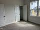 Bedroom with carpet floors features closet space and a window view to the exterior at 143 Prency Ln, Middlesex, NC 27557