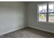 Cozy bedroom featuring a large window and plush carpet at 143 Prency Ln, Middlesex, NC 27557
