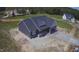 A newly constructed gray home with a stone-accented porch and a two-car garage on a spacious lot at 143 Prency Ln, Middlesex, NC 27557