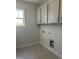 Laundry room with upper cabinets and hookups at 143 Prency Ln, Middlesex, NC 27557