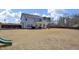 A view of the house from the expansive backyard, featuring a large lawn at 149 Minter School Rd, Sanford, NC 27332