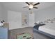 bedroom with a gray carpet, a ceiling fan, and a comfortable bed and furniture at 149 Minter School Rd, Sanford, NC 27332