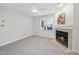 Inviting living room features a fireplace, window and ceiling fan at 1512 Township Cir, Raleigh, NC 27609