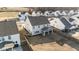 Areal view of a home with an enclosed porch and spacious backyard in a residential neighborhood at 158 Arlie Ln, Lillington, NC 27546