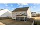 Exterior view of the rear of the home, and the screened-in porch at 158 Arlie Ln, Lillington, NC 27546