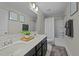 Bathroom featuring double sink vanity, and a shower-tub combo with white shower curtain at 158 Arlie Ln, Lillington, NC 27546