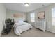 Bright bedroom with a queen sized bed and a dresser at 158 Arlie Ln, Lillington, NC 27546