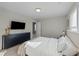 Serene bedroom featuring a large dresser with a TV, and a comfortable bed at 158 Arlie Ln, Lillington, NC 27546