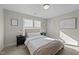 Bright bedroom with natural light, neutral colors, and two windows at 158 Arlie Ln, Lillington, NC 27546