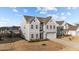 Charming two-story home with neutral siding, well-kept lawn, and attached two car garage at 158 Arlie Ln, Lillington, NC 27546