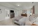 Spacious main bedroom featuring neutral walls, carpet flooring, and ensuite bathroom at 158 Arlie Ln, Lillington, NC 27546