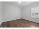 Bedroom features wood-look flooring and a window with blinds at 170 Dunvegan Ln, Burlington, NC 27215