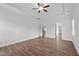 Bright bedroom features tray ceiling with ceiling fan and beautiful wood-look flooring at 170 Dunvegan Ln, Burlington, NC 27215