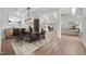 Dining area with stylish lighting and a view into the open concept living room at 170 Dunvegan Ln, Burlington, NC 27215