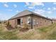 Charming brick home exterior featuring a well-kept lawn, with a side patio entrance, and an irrigation system at 170 Dunvegan Ln, Burlington, NC 27215