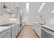 Well-lit kitchen with stainless appliances, large island, and custom backsplash at 170 Dunvegan Ln, Burlington, NC 27215