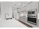 Modern kitchen with stainless steel appliances, quartz countertops, and stylish gray cabinetry at 170 Dunvegan Ln, Burlington, NC 27215