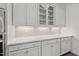 Stylish kitchen with custom backsplash, quartz countertops, stainless appliances and white cabinets at 170 Dunvegan Ln, Burlington, NC 27215