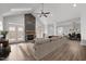 Cozy living room featuring a stone fireplace, french doors to the outdoor patio, and comfortable furnishings at 170 Dunvegan Ln, Burlington, NC 27215
