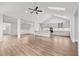 Open-concept living room with skylights flows to a modern kitchen, great for entertaining at 170 Dunvegan Ln, Burlington, NC 27215