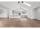 Bright living room features vaulted ceiling, skylights, and flows seamlessly to the modern kitchen at 170 Dunvegan Ln, Burlington, NC 27215
