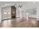Inviting living room with a stone fireplace, vaulted ceiling, and access to the outdoor space at 170 Dunvegan Ln, Burlington, NC 27215