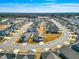 Wide aerial view of a large residential community with similar style homes and mature trees at 1727 Pinecliff Ct, Fuquay Varina, NC 27526