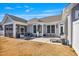 Backyard with a patio, screened porch, and a well-maintained lawn at 1727 Pinecliff Ct, Fuquay Varina, NC 27526