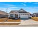 Charming single Gathering home with beautiful curb appeal, manicured lawn and two car garage at 1727 Pinecliff Ct, Fuquay Varina, NC 27526