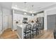 Kitchen featuring a center island, white cabinets, stainless steel appliances, and pendant lighting at 1727 Pinecliff Ct, Fuquay Varina, NC 27526