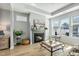 Cozy living room with a fireplace, mantel and large windows bringing in natural light at 1727 Pinecliff Ct, Fuquay Varina, NC 27526