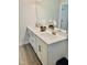 Modern bathroom with double sinks, white cabinets, and a large mirror perfect for a Gathering at 1981 Rosedale Ridge Ave, Wake Forest, NC 27587