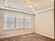 Bedroom features carpeted floors, neutral walls, recessed lighting, and a large window at 1981 Rosedale Ridge Ave, Wake Forest, NC 27587