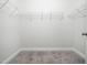 Walk-in closet with wire shelving and carpeted floor at 1981 Rosedale Ridge Ave, Wake Forest, NC 27587