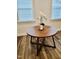 Cozy dining area featuring a round wooden table and decorative floral arrangement at 1981 Rosedale Ridge Ave, Wake Forest, NC 27587