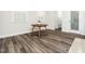 Bright dining area with views through the window and wood-look flooring at 1981 Rosedale Ridge Ave, Wake Forest, NC 27587