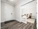 Bright entryway with wood floors and view to bedroom with natural light at 1981 Rosedale Ridge Ave, Wake Forest, NC 27587