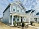 Charming two-story home with grey siding, white trim, and a welcoming front porch at 1981 Rosedale Ridge Ave, Wake Forest, NC 27587