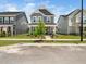 Charming two-story home with gray siding, a landscaped yard, and a welcoming front porch at 1981 Rosedale Ridge Ave, Wake Forest, NC 27587